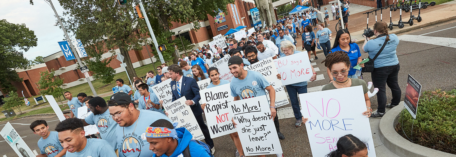 participants in the "Walk a Mile in Her Shoes" event